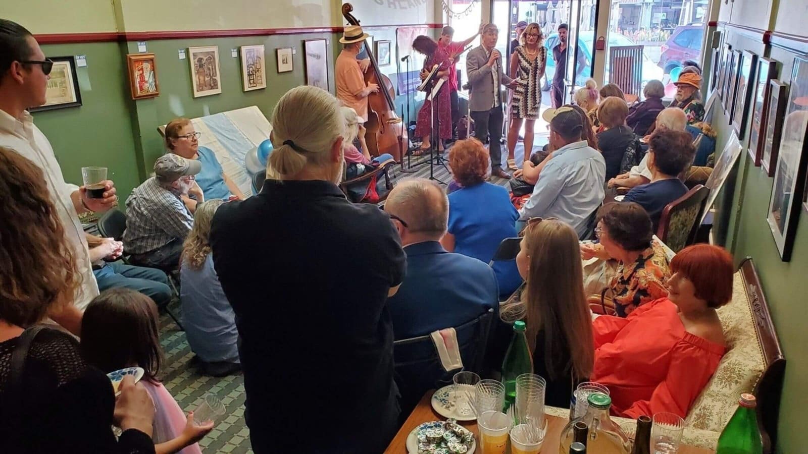 a crowd in Yiddishland California observing a speaker
