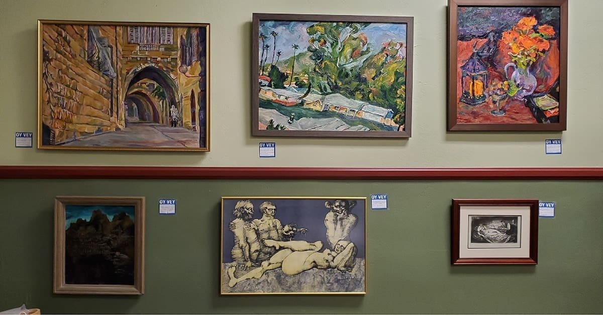 a wall displaying six paintings of various subjects, like architecture, landscape, and humans