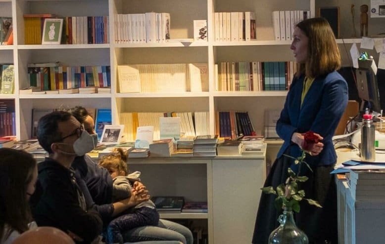 author Tanya Yakovleva giving a lecture in a bookstore