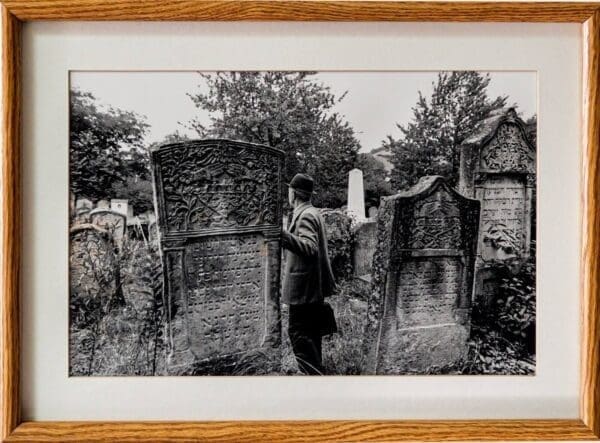 Man Visiting Cemetery by Yale Strom