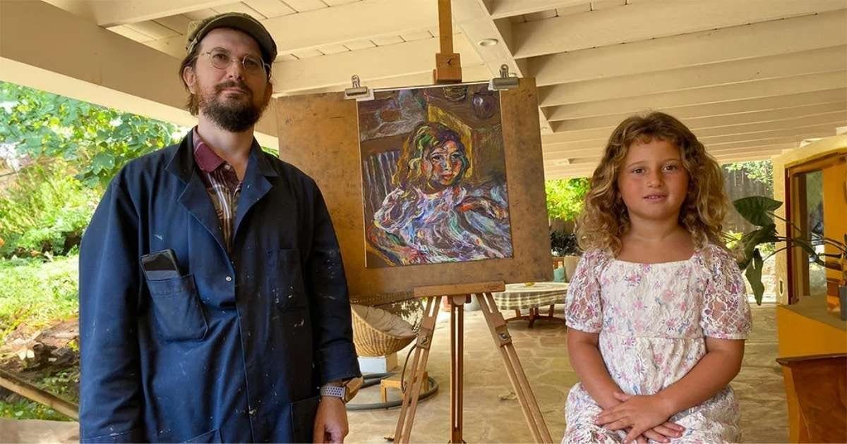 portraits-for-website oleg tsank and esterke are posing in front of a portrait of esterke.