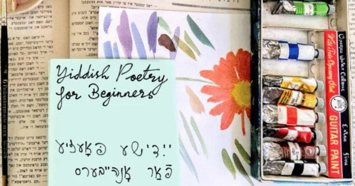 Painting sheets and colors representing creative expression in a Yiddish poetry course